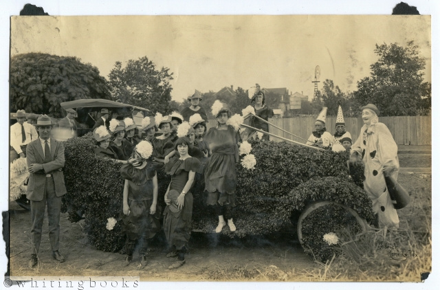 [Photograph]: Kenedy, Texas Art Car with Women and Clowns circa 1920s; Photograph by Dedrick in Kenedy