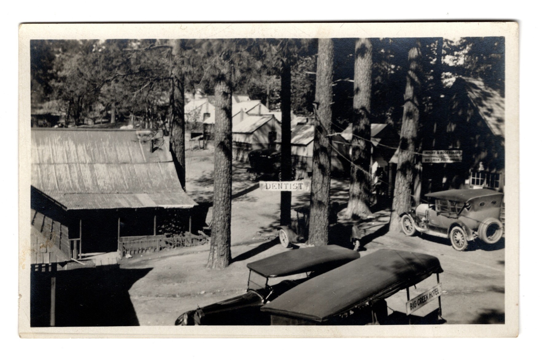 Big Creek, Fresno County, California Photo Postcard circa 1920s Street View with Signs for Dentist, Aggergaard & Imhoff, and Post Office