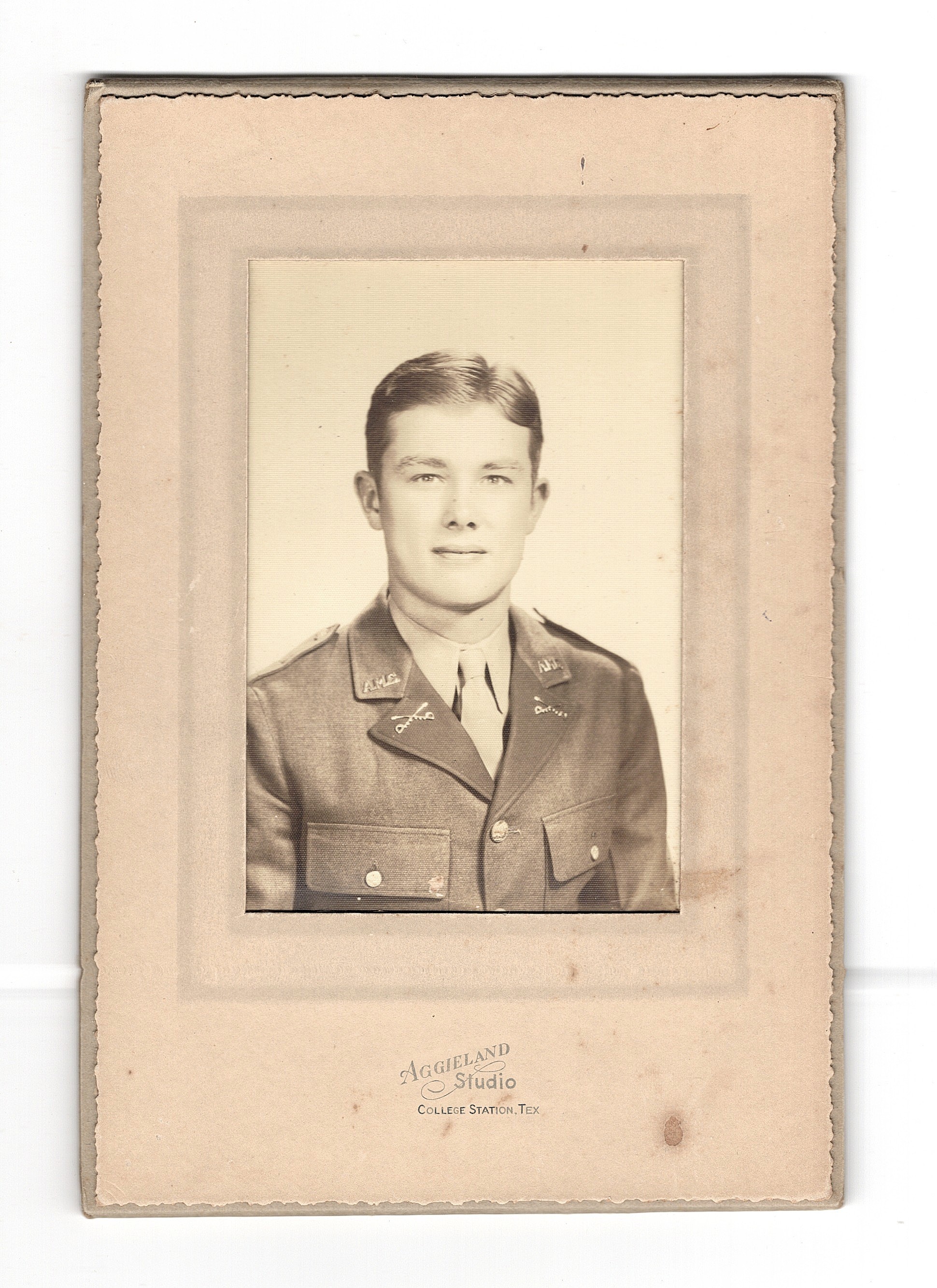 Photographic Portrait: Member of the Corps of Cadets at the Agricultural and Mechanical College of Texas (Texas A&M University since 1963), circa 1940s, by Aggieland Studio in College Station, Texas